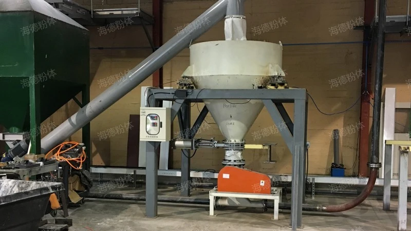 Ton bag unloading and conveying system